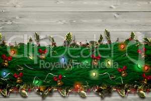 Composite image of fir branch christmas decoration garland