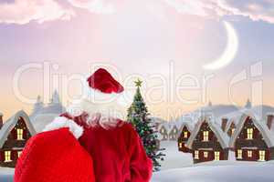 Composite image of santa claus carrying sack