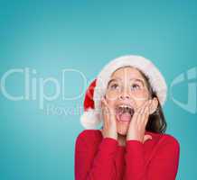 Composite image of festive little girl looking surprised