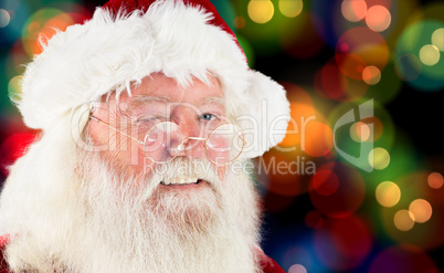 Composite image of santa claus winking