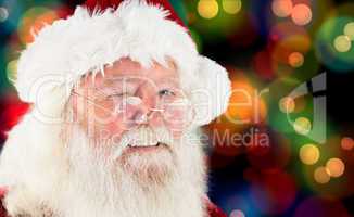 Composite image of santa claus winking