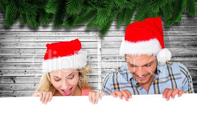 Composite image of young festive couple