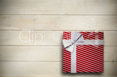 Composite image of christmas present with bow