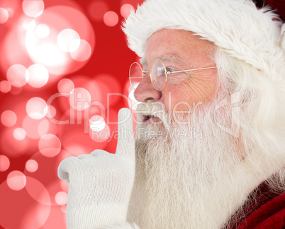 Composite image of santa claus making quiet sign