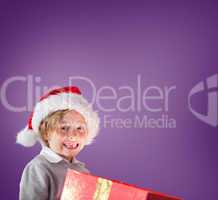 Composite image of festive boy opening gift