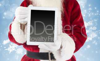 Composite image of santa claus showing tablet pc