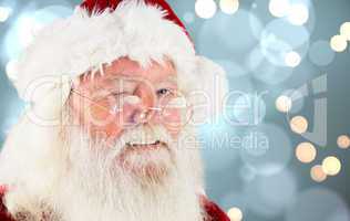 Composite image of santa claus winking