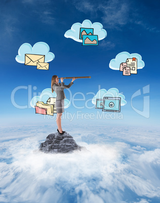 Composite image of businesswoman looking through a telescope