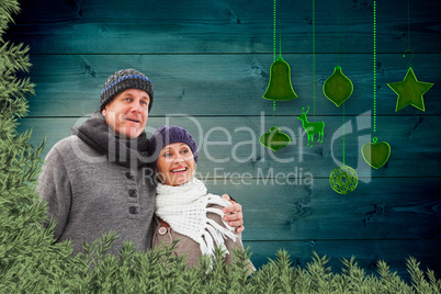 Composite image of mature winter couple