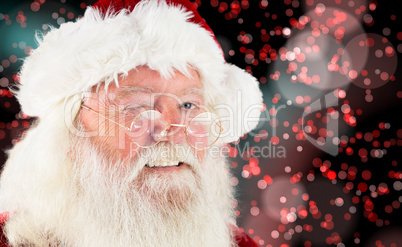 Composite image of santa claus winking