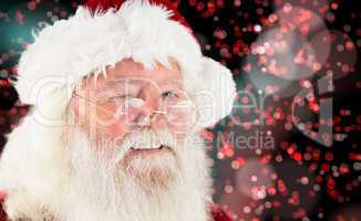 Composite image of santa claus winking