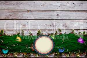 Composite image of fir branch christmas decoration garland