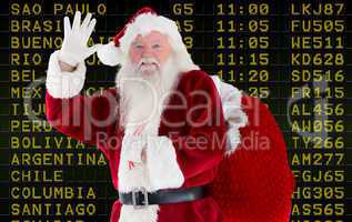 Composite image of santa claus waving