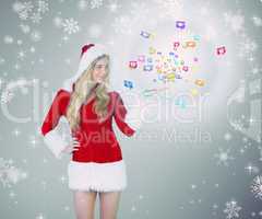 Composite image of pretty girl presenting in santa outfit