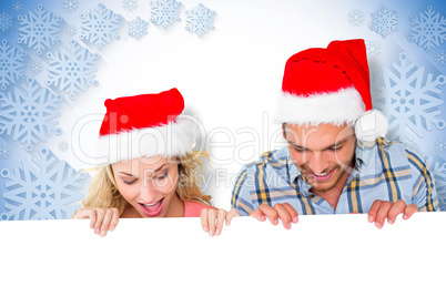 Composite image of young festive couple