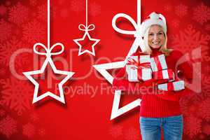 Composite image of happy festive blonde with gift