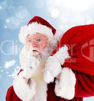 Composite image of santa claus carrying sack