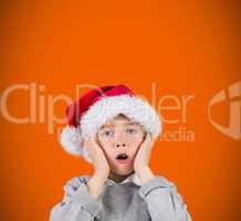 Composite image of festive surprised boy
