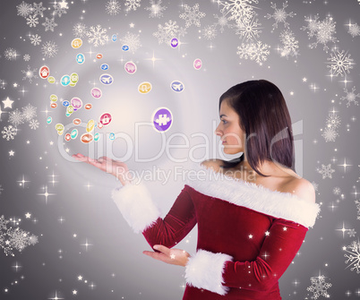Composite image of pretty girl presenting in santa outfit Composite image of pretty girl presenting in santa outfit
