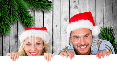 Composite image of young festive couple