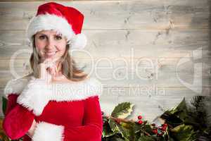 Composite image of pretty girl in santa outfit