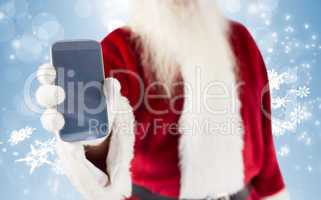 Composite image of santa claus showing smartphone