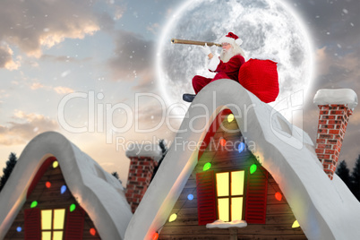 Composite image of santa sitting on roof of cottage