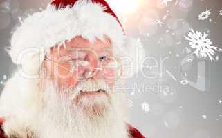 Composite image of santa claus winking