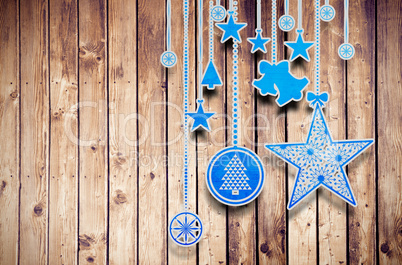 Composite image of hanging christmas decorations