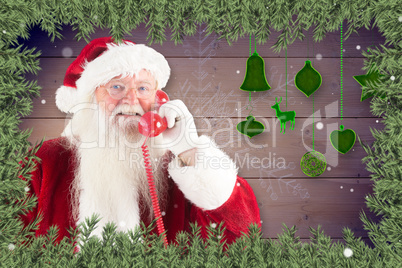 Composite image of santa claus on the phone