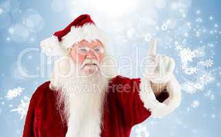 Composite image of santa claus pointing