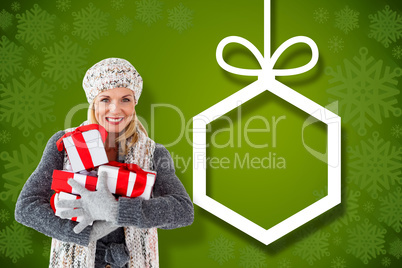 Composite image of happy blonde with gifts