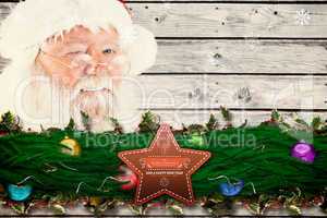 Composite image of santa claus winking