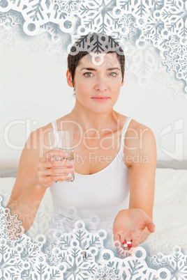 Composite image of young woman taking pills