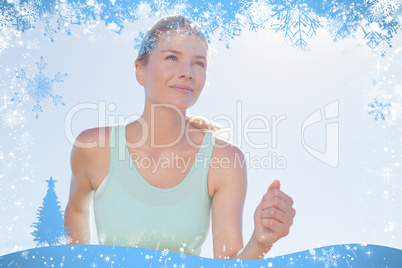 Fit woman jogging and smiling