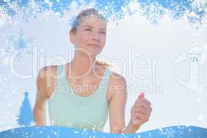 Fit woman jogging and smiling