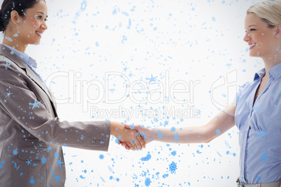 Close up of women shaking hands