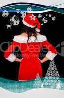 Pretty brunette in santa outfit posing with hands on hips