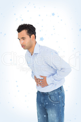 Casual young man with stomach pain