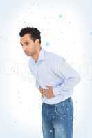 Casual young man with stomach pain