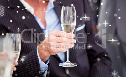 Close up of a senior businessman holding a glass of champagne