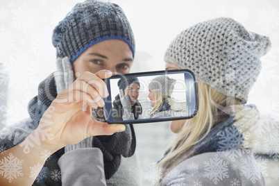 Hand holding smartphone showing photo