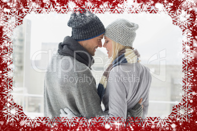 Cute couple in warm clothing hugging