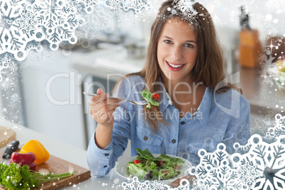 Composite image of pretty woman eating a salad