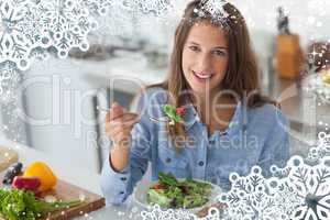 Composite image of pretty woman eating a salad