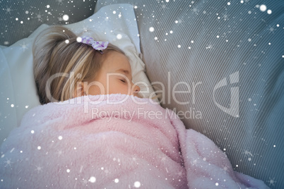 High angle view of a girl sleeping on sofa