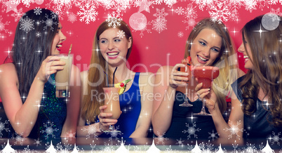 Composite image of four friends having a party holding cocktails