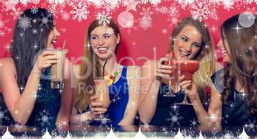 Composite image of four friends having a party holding cocktails