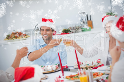 Happy family clinking their glasses of white wine