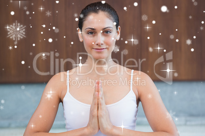 Peaceful woman in white sitting in lotus pose